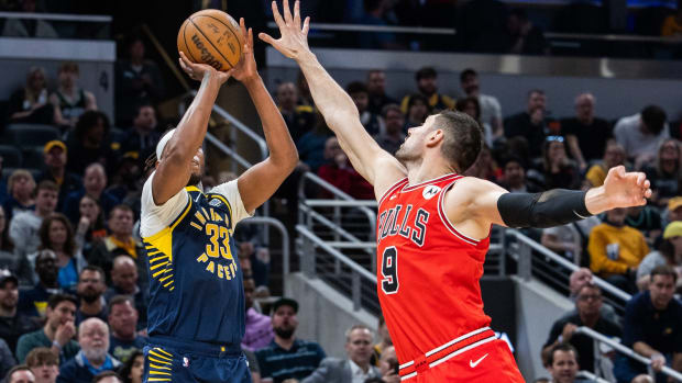 Indiana Pacers center Myles Turner (33) shoots the ball while Chicago Bulls center Nikola Vucevic (9) defends in the second half at Gainbridge Fieldhouse.